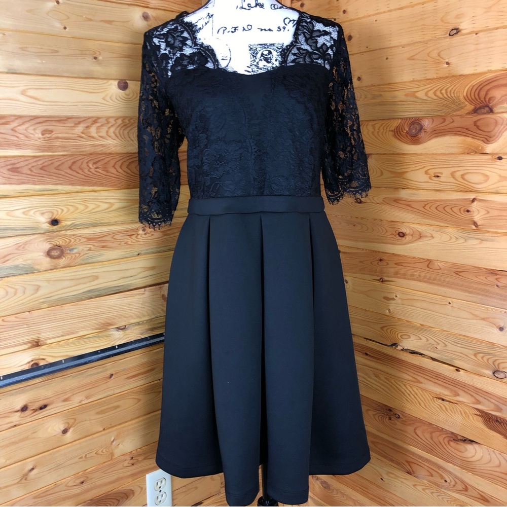 Formal black dress with eyelash lace details throughout top. Very classy